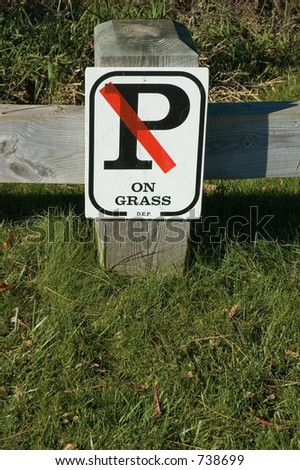 By order of the Department of  Environmental Protection, No Parking on the Grass sign.