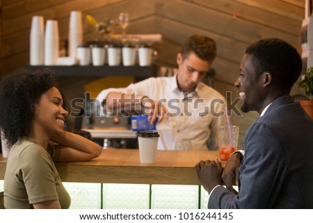 https://image.shutterstock.com/display_pic_with_logo/2780032/1016244145/stock-photo-african-american-man-and-woman-flirting-talking-at-bar-counter-black-couple-enjoying-drinks-and-1016244145.jpg