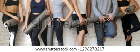 Similar – Image, Stock Photo Group of young sporty attractive women in yoga studio, practicing yoga lesson with instructor, stretching and relaxing after workout . Healthy active lifestyle, working out indoors in gym