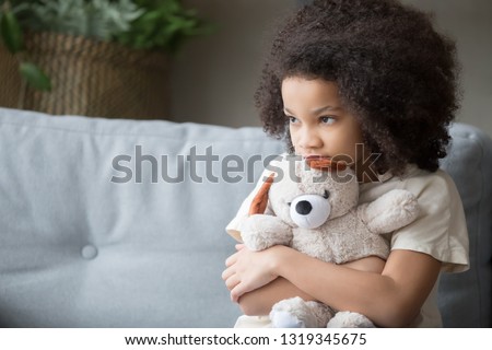 Similar – Image, Stock Photo troubled child with a tear on his face