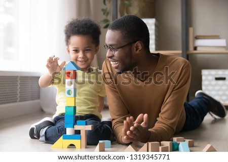 Similar – Image, Stock Photo Small wooden blocks with character icons and a gear shape around them