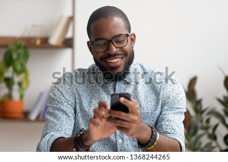 Similar – Image, Stock Photo Young black man enjoying music in headphones