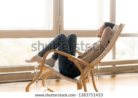 Image, Stock Photo Glad woman sitting near building wall in city