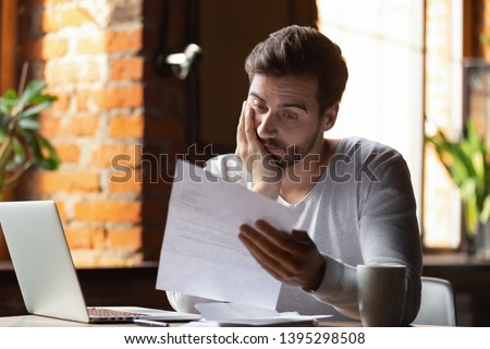 Confused frustrated young man reading letter in cafe, debt notification, bad financial report, money problem, money problem, upset student receiving bad news, unsuccessful exam or test results ストックフォト © 