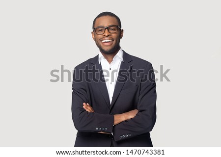 Similar – Image, Stock Photo Young Black man standing in the street while listening music by headphones