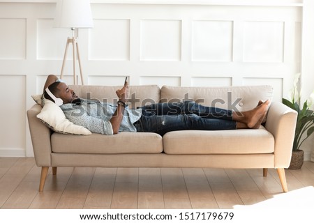 Similar – Image, Stock Photo Man lying down holding mirror with reflection