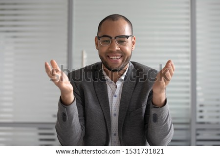 Portrait African American businessman wearing glasses looking at camera and talking, making video call, mentor coach tutor recording webinar, online course, hr manager holding distance job interview 商業照片 © 