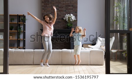 Similar – Image, Stock Photo 2 children jumping on a bouncy cushion in the park