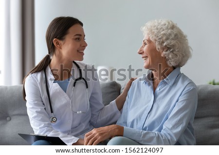 Similar – Image, Stock Photo Positive female patient sitting on bed in hospital