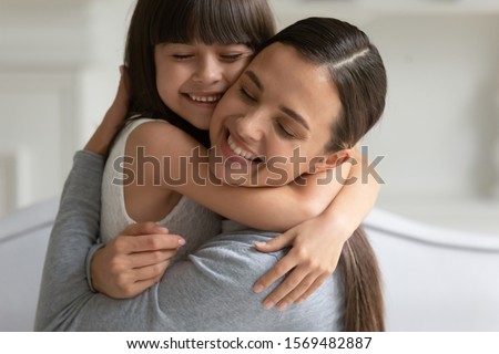 Similar – Image, Stock Photo Woman caressing adorable little kitten