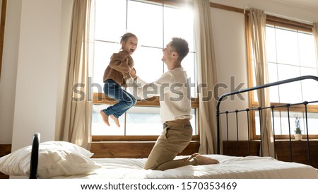 Similar – Image, Stock Photo 2 children jumping on a bouncy cushion in the park