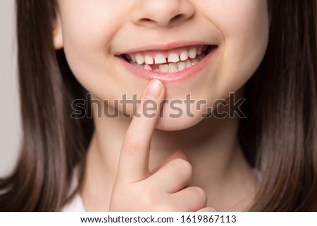 Similar – Image, Stock Photo Toothless girl smiling for camera