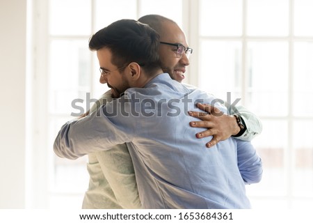 Similar – Image, Stock Photo Happy couple colleagues hugging on the street