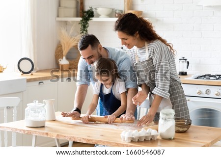 Similar – Foto Bild Kleine Tochter macht mit der Mutter zu Hause einen handgemachten Pompon