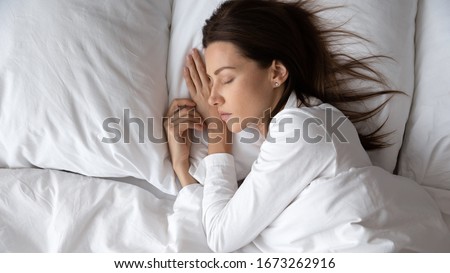 Similar – Image, Stock Photo carefree brunette woman lying on the floor laughing