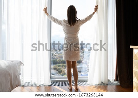 Similar – Image, Stock Photo Barefoot woman standing on beach at sunset