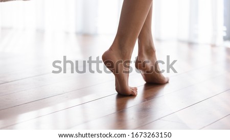 Similar – Image, Stock Photo Crop barefoot woman walking along seaside