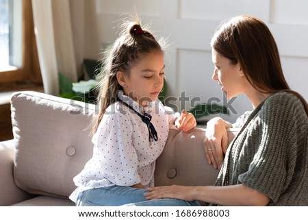 Similar – Image, Stock Photo Compassionately, the little girl sits at home, with the broken doll, in the sunlight.