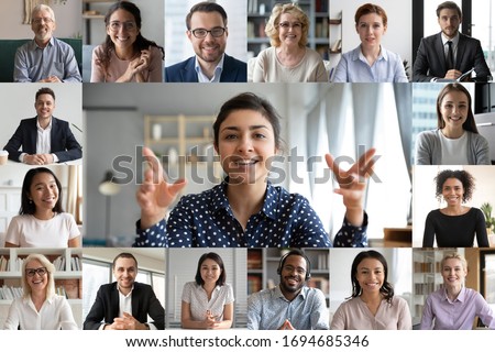 Webcam laptop screen view many faces of diverse people involved in group videoconference on-line meeting lead by indian businesswoman leader, team using video call app work solve common issues concept Foto d'archivio © 