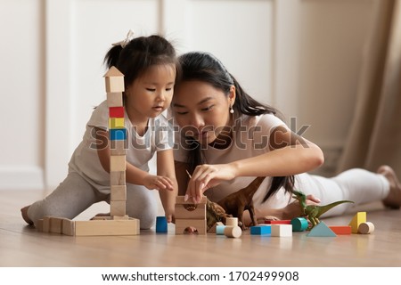 Similar – Image, Stock Photo Small girls building toy construction machine