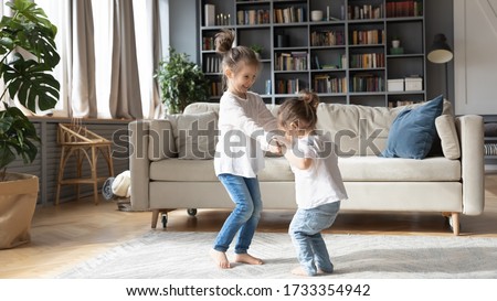 Similar – Image, Stock Photo Little Caucasian Girl in costume of which orange and black color and celebrating Halloween outdoor