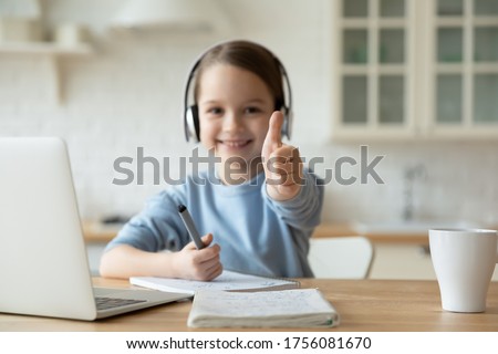 Similar – Image, Stock Photo Schoolgirls looking for audio books in school library. Students choosing books. Elementary education. Doing homework. Back to school