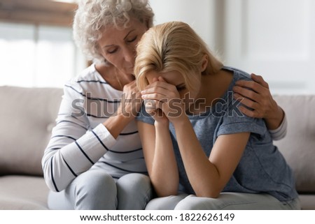 Similar – Image, Stock Photo Tender mother embracing sad son