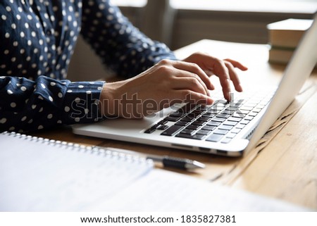 Close up image female hands typing on laptop keyboard. Businesswoman text response to client e-mail, customer buy on-line using web shop services. Internet and modern wireless technology usage concept 商業照片 © 
