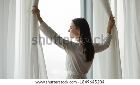 Similar – Foto Bild Frau am Fenster