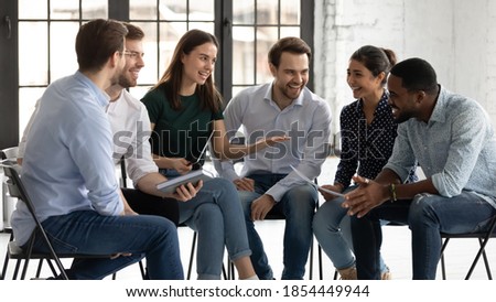 You are quite right! Friendly young female business trainer or team leader praising encouraging black male trainee subordinate for giving correct answer good proposition on group session or briefing Foto d'archivio © 