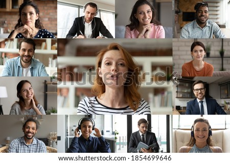 Focused young red-haired female employee leader holding video conference working call with happy diverse multiracial colleagues teammates, enjoying distant web brainstorming briefing meeting.