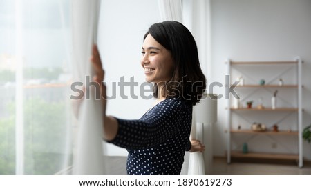 Similar – Image, Stock Photo Satisfied Asian resting female in casual wear having relaxation at tropical hotel