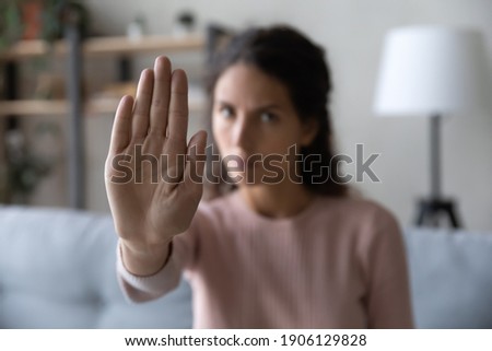Close up serious confident strong caucasian woman showing stop gesture with hand, protesting about domestic violence or saying no to abuse bullying, denying gender discrimination or abortion. Foto stock © 