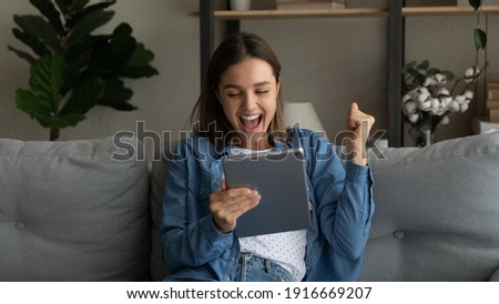 Emotional young female sport fan scream yes watch winning victory of favorite team on pad pc online. Excited woman student read email from college about getting scholarship for personal achievement