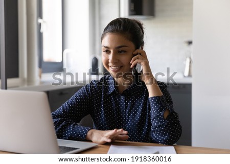 Similar – Image, Stock Photo Businesswoman having smartphone conversation near gray wall