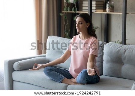 Image, Stock Photo Peaceful Arab woman doing yoga on embankment