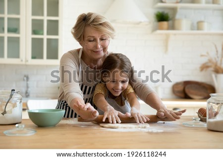 Similar – Image, Stock Photo Making a pie at home. Strawberries and rhubarb pie ingredients