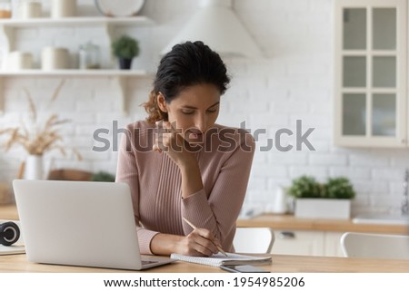 Similar – Image, Stock Photo Ethnic woman taking notes in notebook at home