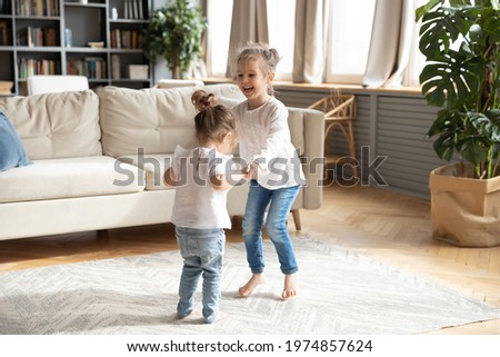 Similar – Image, Stock Photo Little Caucasian Girl in costume of which orange and black color and celebrating Halloween outdoor