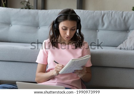 Similar – Image, Stock Photo Ethnic woman taking notes in notebook at home