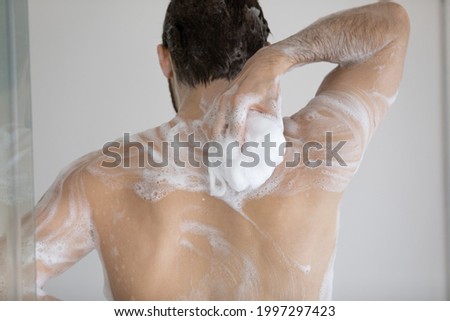 Similar – Image, Stock Photo Man taking shower in wooden bathroom