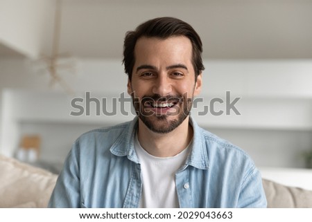 Similar – Image, Stock Photo Young men making video call with phone  while sitting on the sofa at home