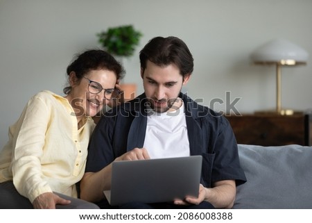 Similar – Image, Stock Photo Mother and son enjoying a bike trip together