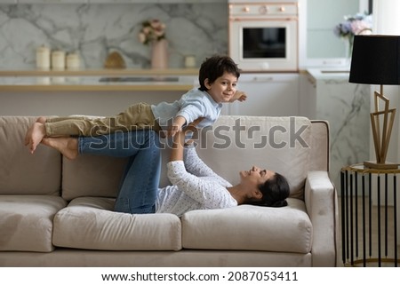 Similar – Image, Stock Photo Cute small boy doing faces in his free time by the river