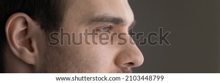 Wide image dreamy motivated man eyes cropped close up, panoramic banner confident dreamy businessman entrepreneur executive looking in distance, visualizing new opportunities, dreaming of success Foto stock © 