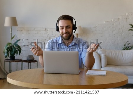 Similar – Image, Stock Photo Man with headphones working on computer