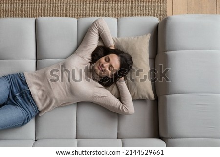 Similar – Image, Stock Photo Smiling woman lying in bed with dog