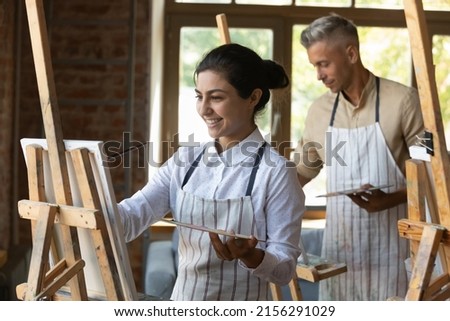 Similar – Image, Stock Photo Creative craftswoman painting picture in workshop