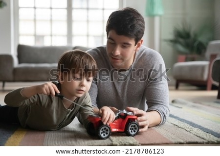 Similar – Image, Stock Photo Boy child using screwdriver at home