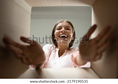 Image, Stock Photo View from below to a balcony on which a folded clotheshorse is leaning against the wall and an empty flowerpot is standing on the balustrade